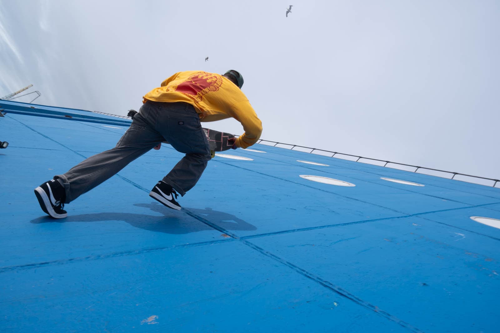 Skater runs to set up a trick on steep wall